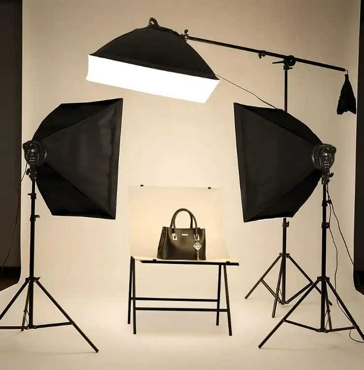 Handbag photographed on a table between two Kshioe softboxes against a cream studio backdrop